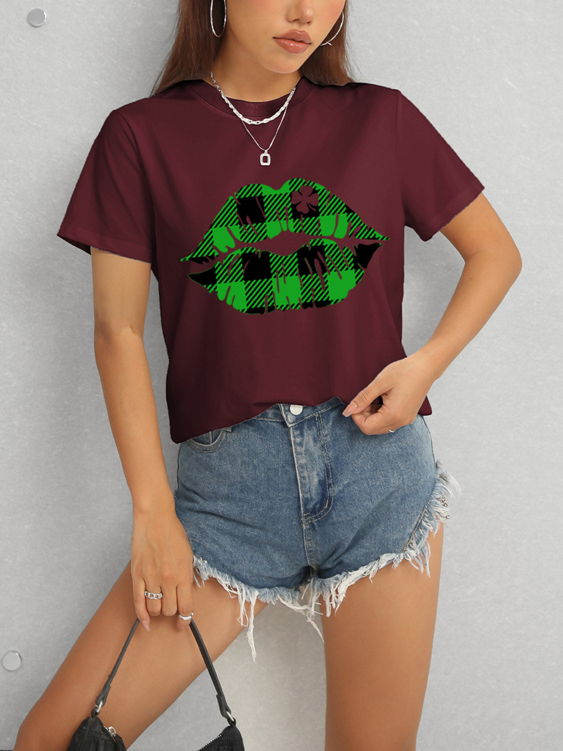 Burgundy t-shirt with green plaid lip design