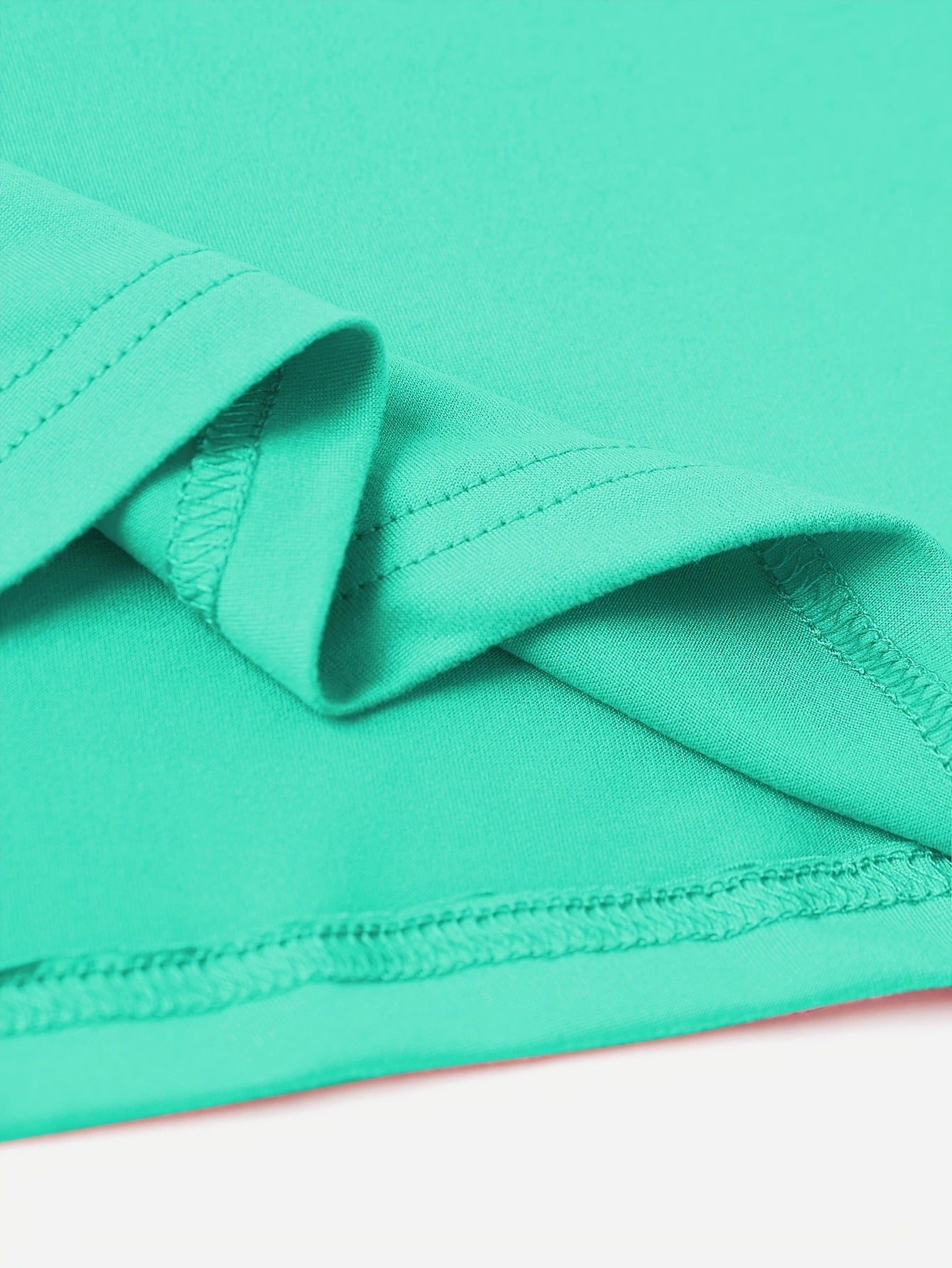 Close-up of mint green T-shirt fabric