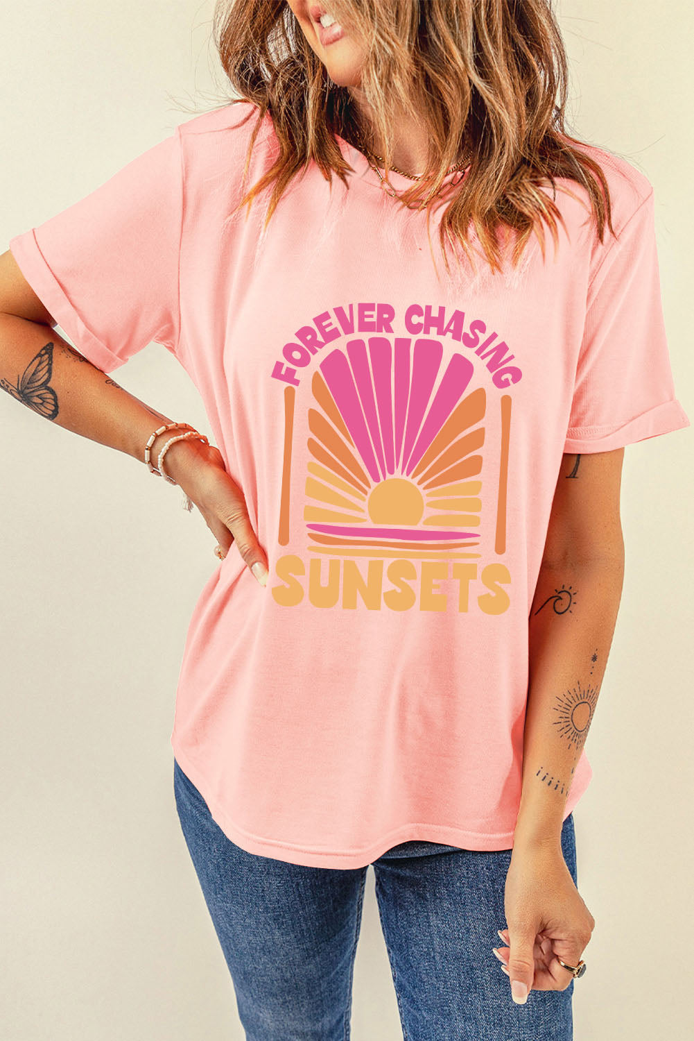 Casual pink t-shirt with sunset graphic and text
