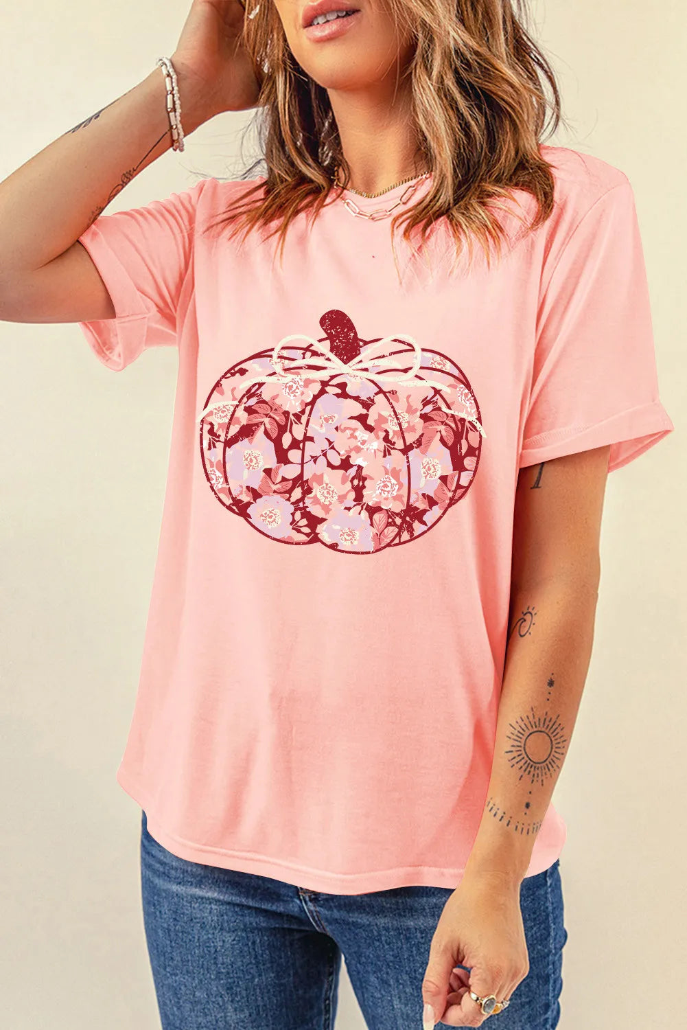 Front view of pink pumpkin graphic round neck t-shirt
