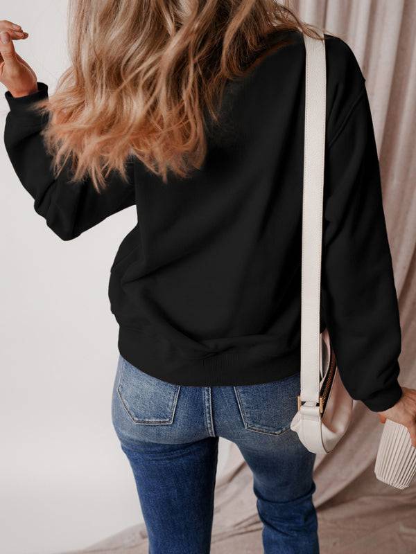 Back view of black Merry Christmas sweatshirt with long sleeves.