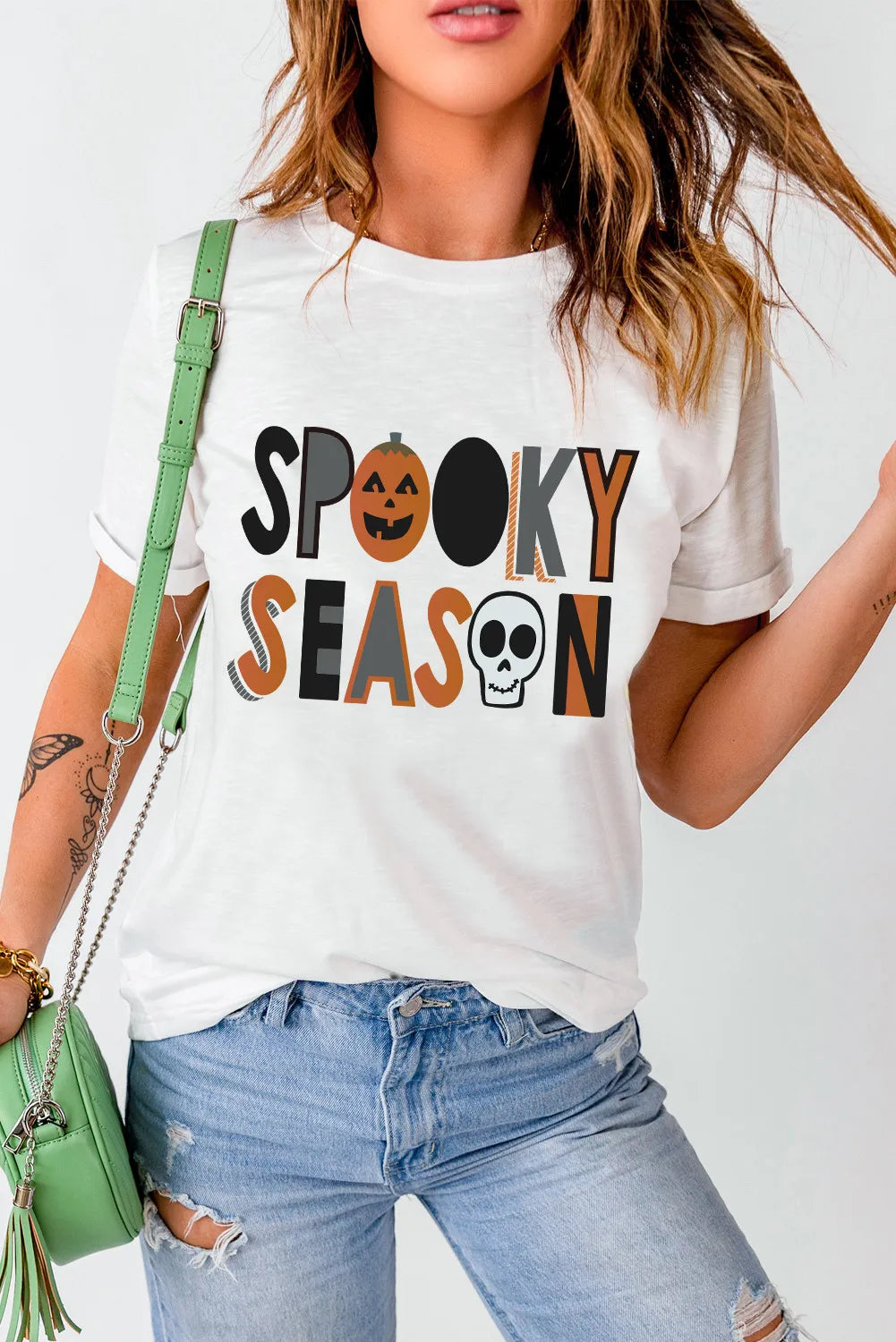 Round neck T-shirt with Spooky Season letter graphic.
