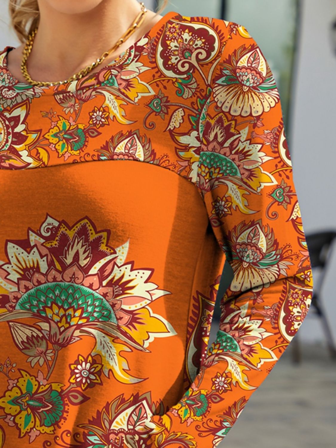 Close-up of FAM-FAM printed round neck long sleeve t-shirt