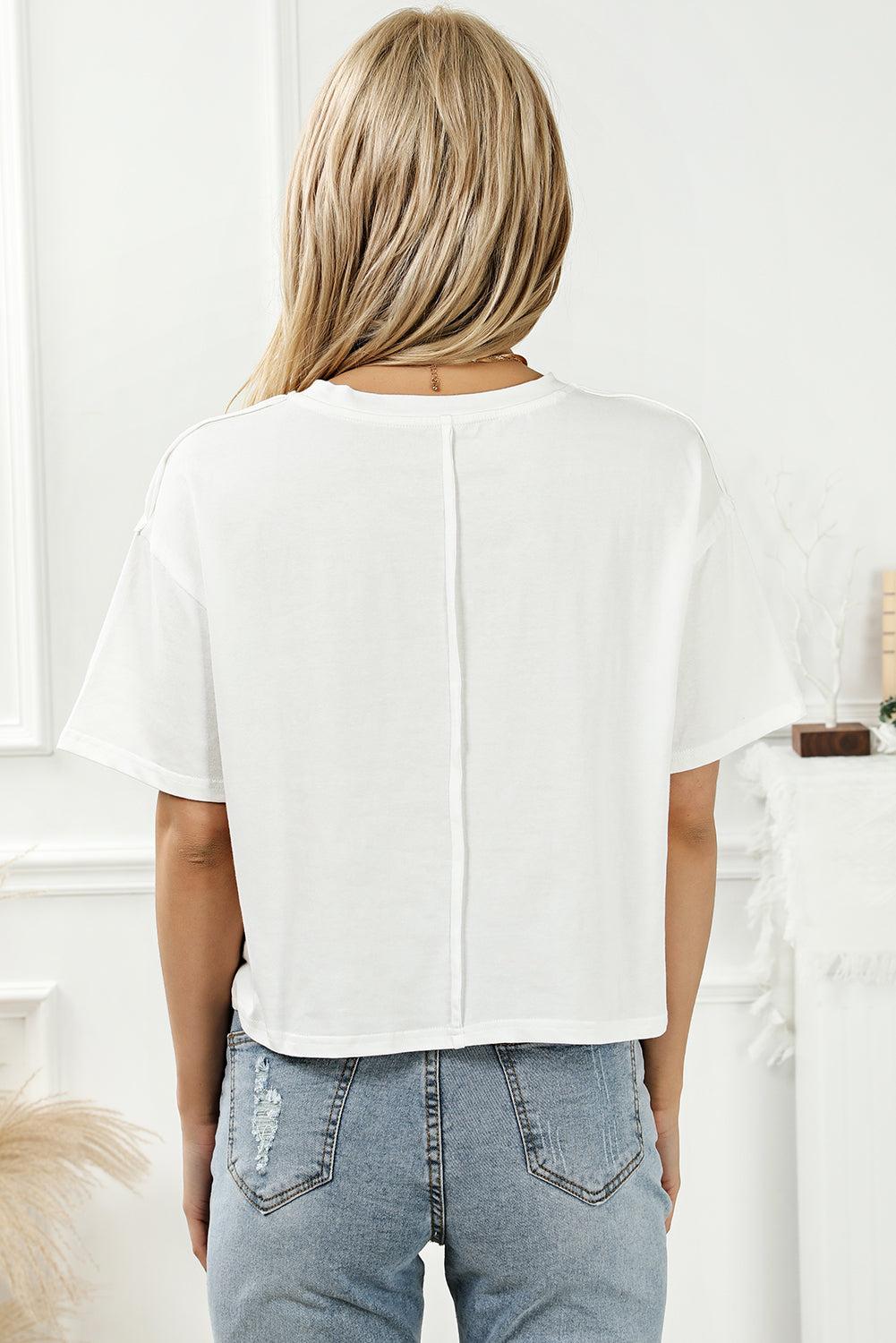 Back view of white round neck T-shirt