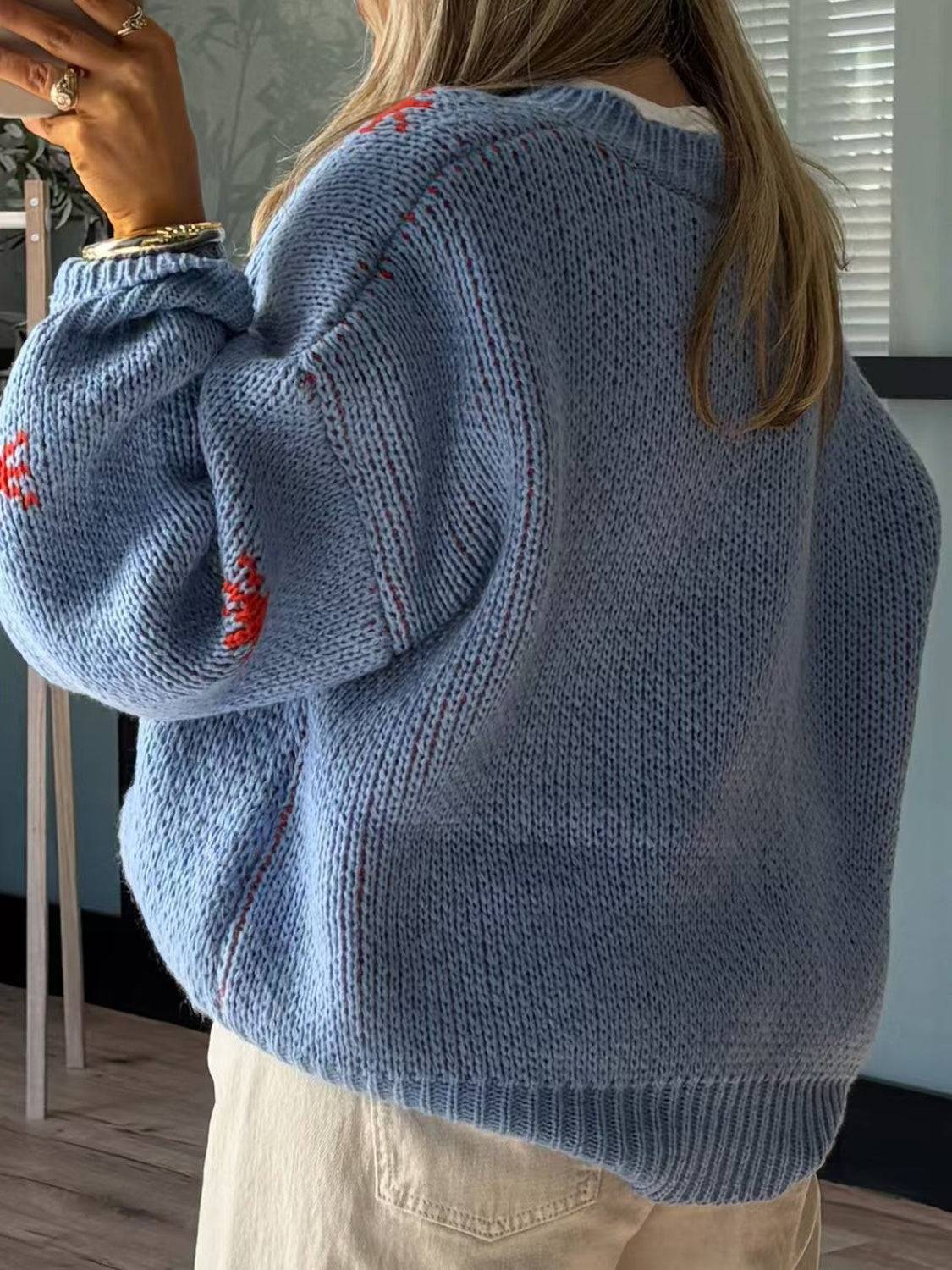 Back view of blue dropped shoulder sweater