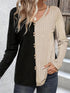 Two-tone long sleeve T-shirt with decorative buttons.