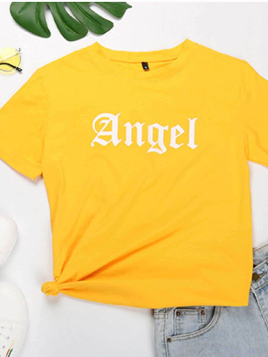 Yellow Angel T-shirt styled with denim shorts