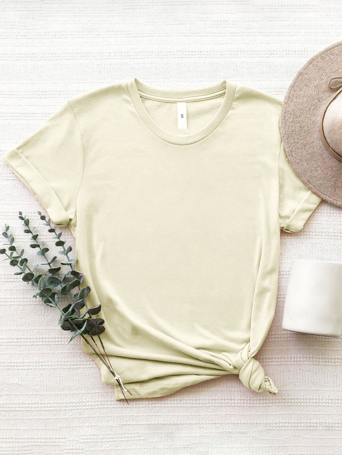 Plain cream round neck T-shirt styled with accessories