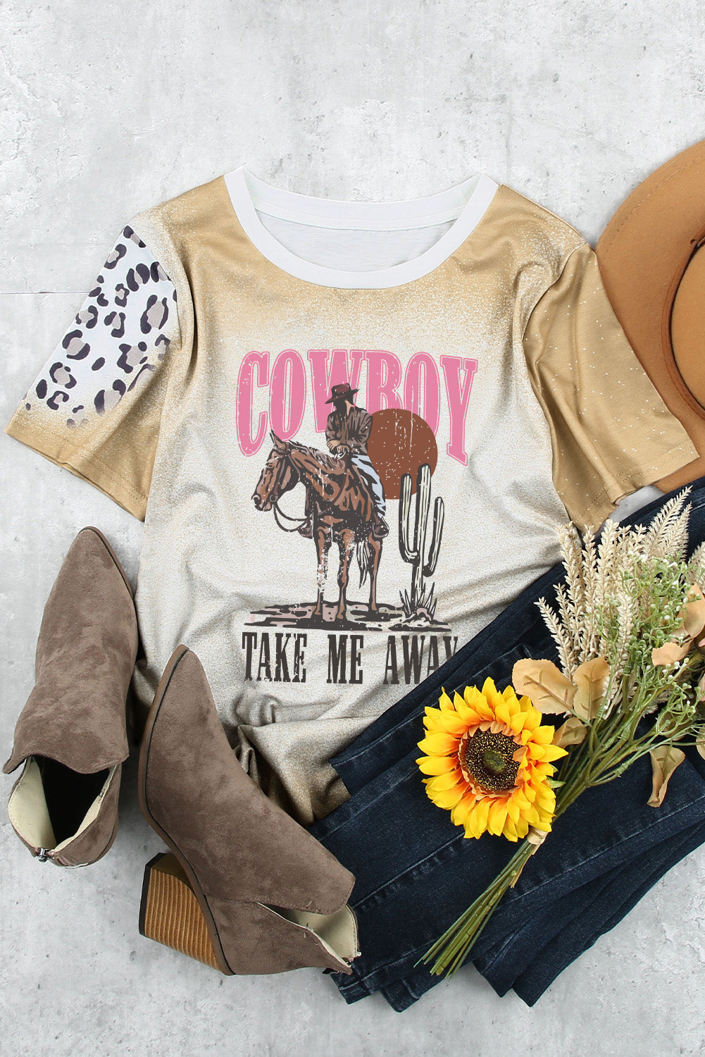 Cowboy graphic T-shirt styled with boots and accessories