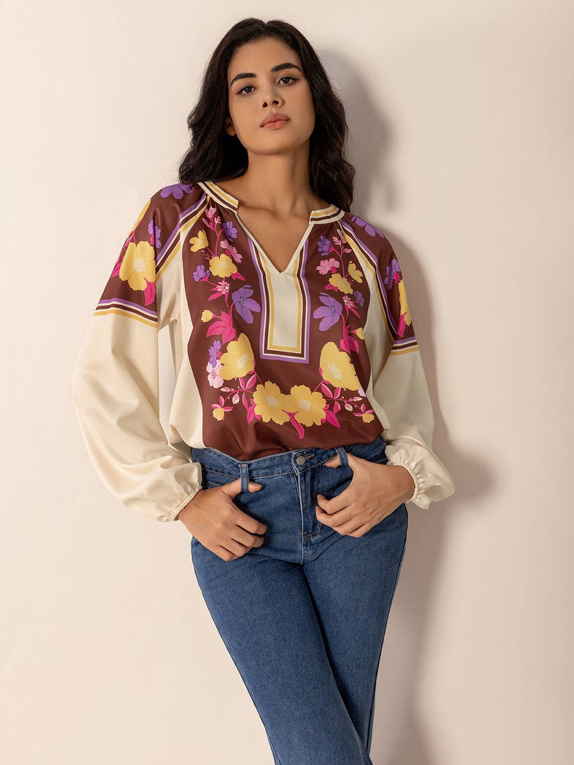 Model wearing floral printed notched blouse