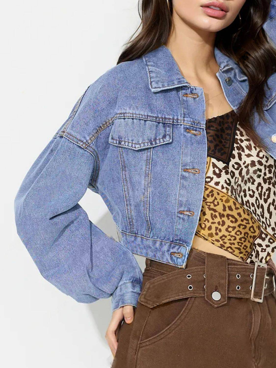 Side view of collared cropped denim top with dropped shoulders.
