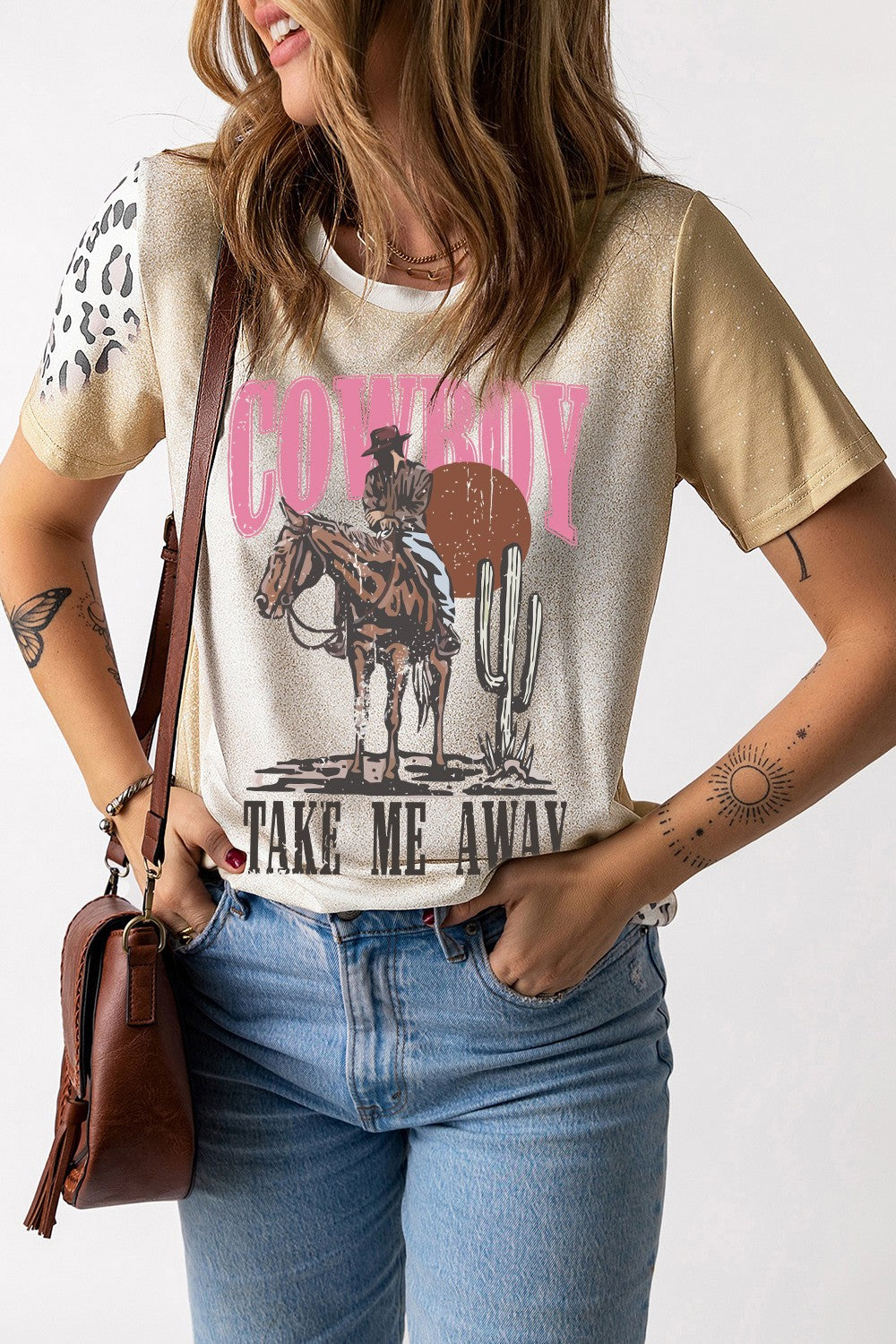 Cowboy graphic T-shirt with short sleeves, styled with jeans