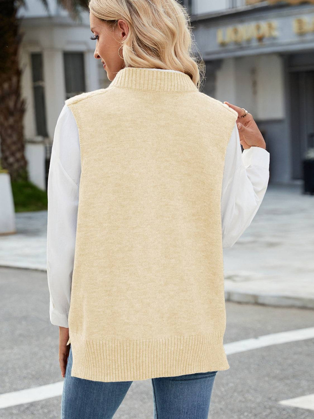 Beige cable knit V-neck sweater vest, back view