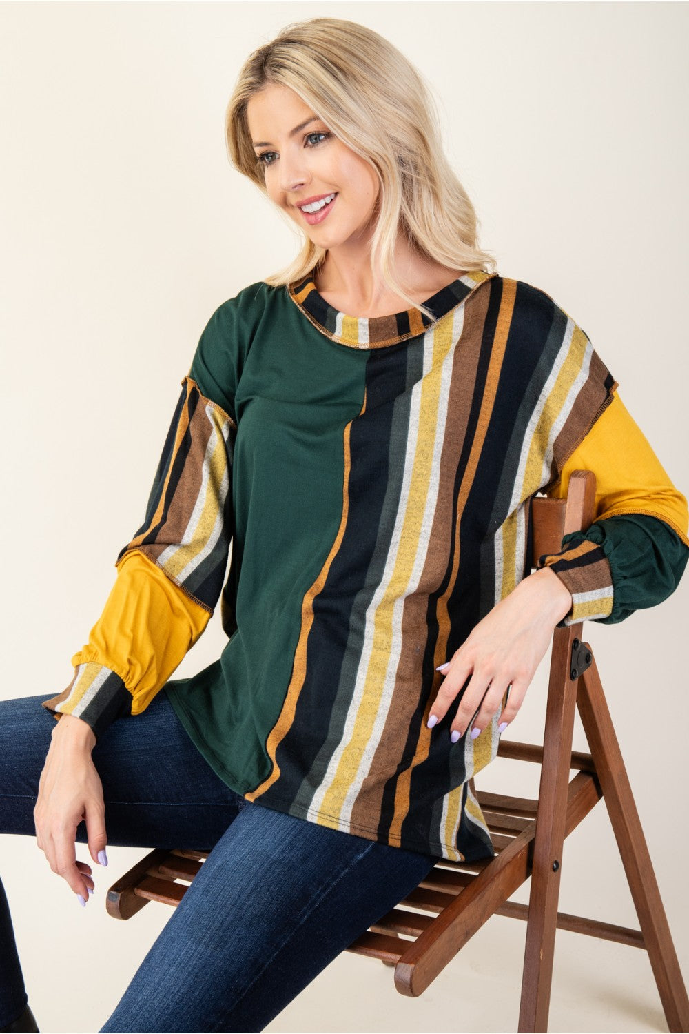 Celeste striped color block T-shirt, seated pose