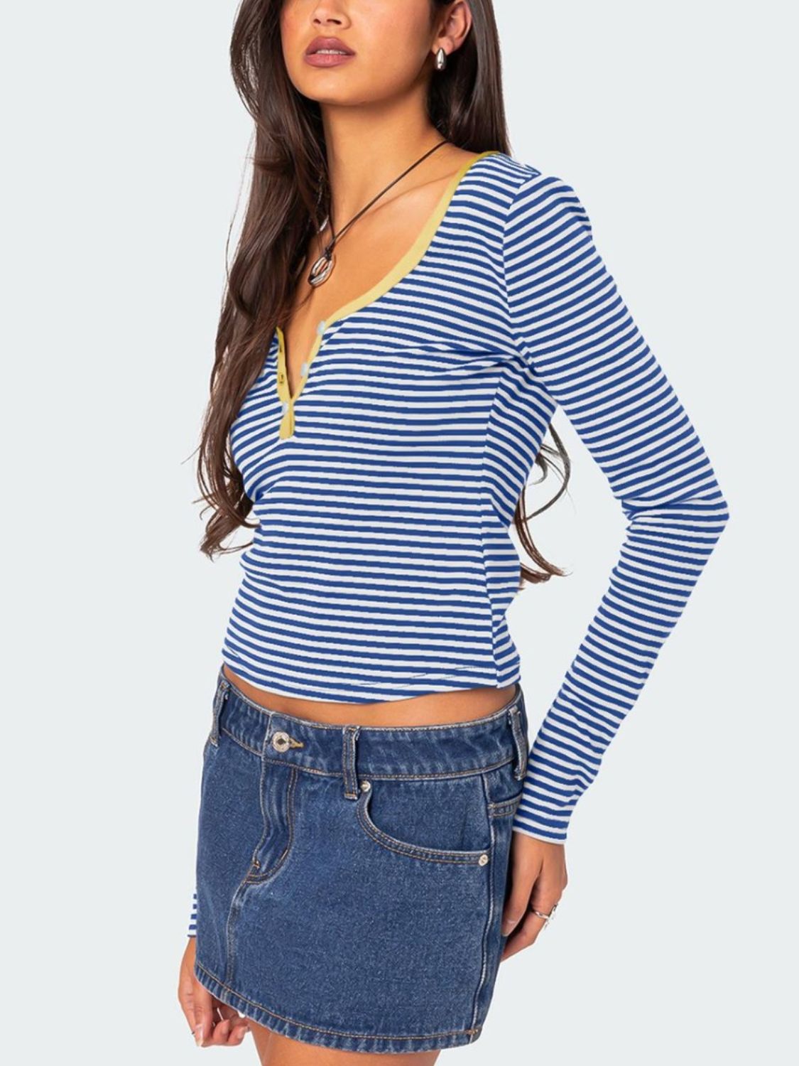 Side view of blue and white striped T-shirt with yellow trim