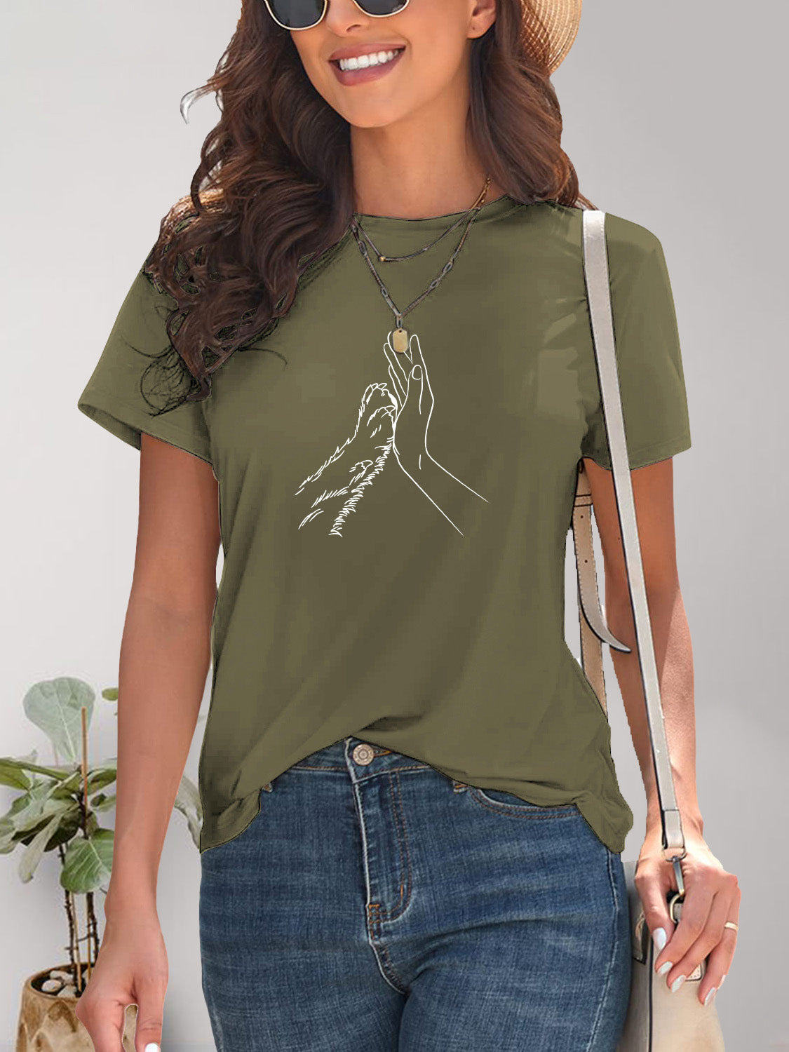 Olive green T-shirt with hand and paw graphic