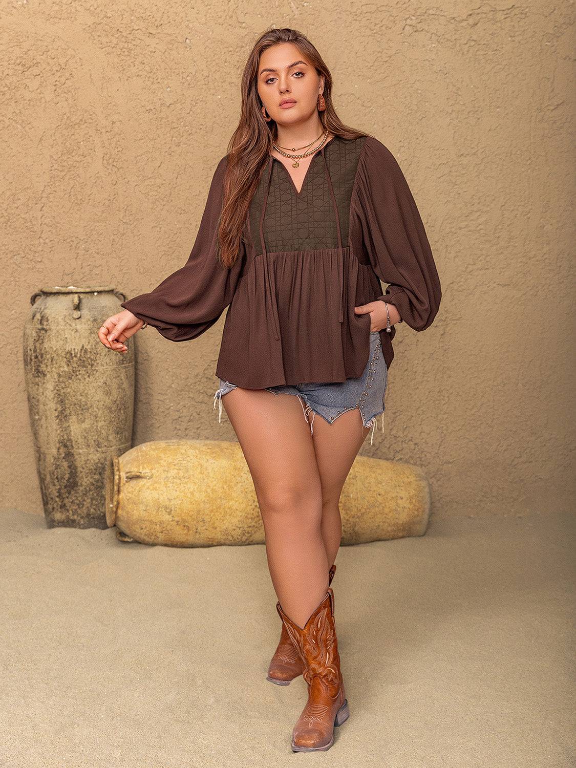 Full body view of plus size tie neck balloon sleeve blouse