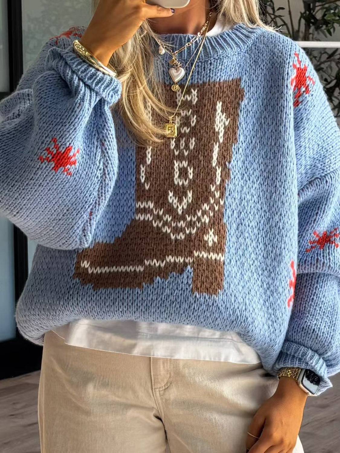 Blue sweater with boot pattern and dropped shoulders