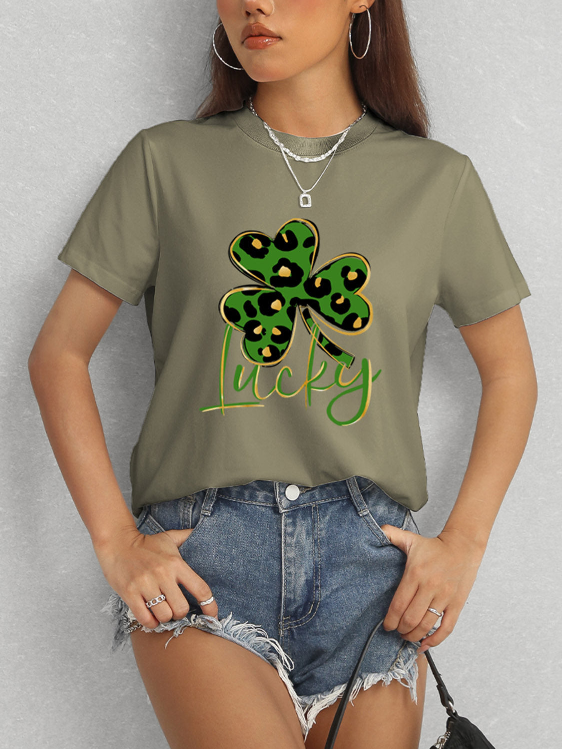 Model wearing black Lucky Clover T-Shirt with shorts