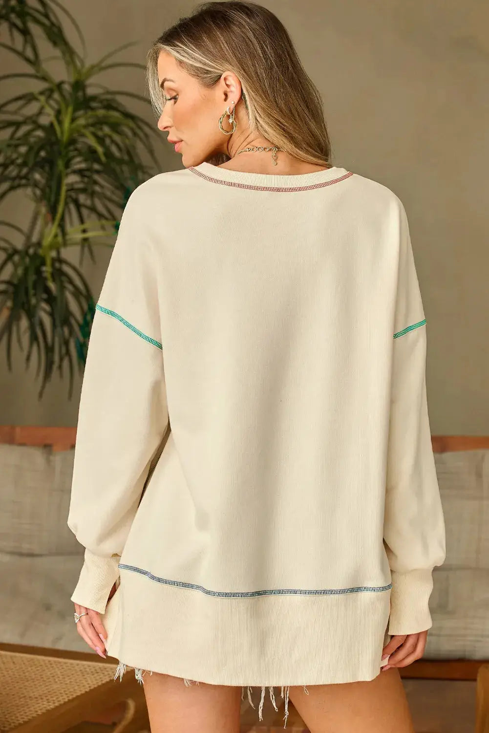 Back view of high-low contrast stitching sweatshirt