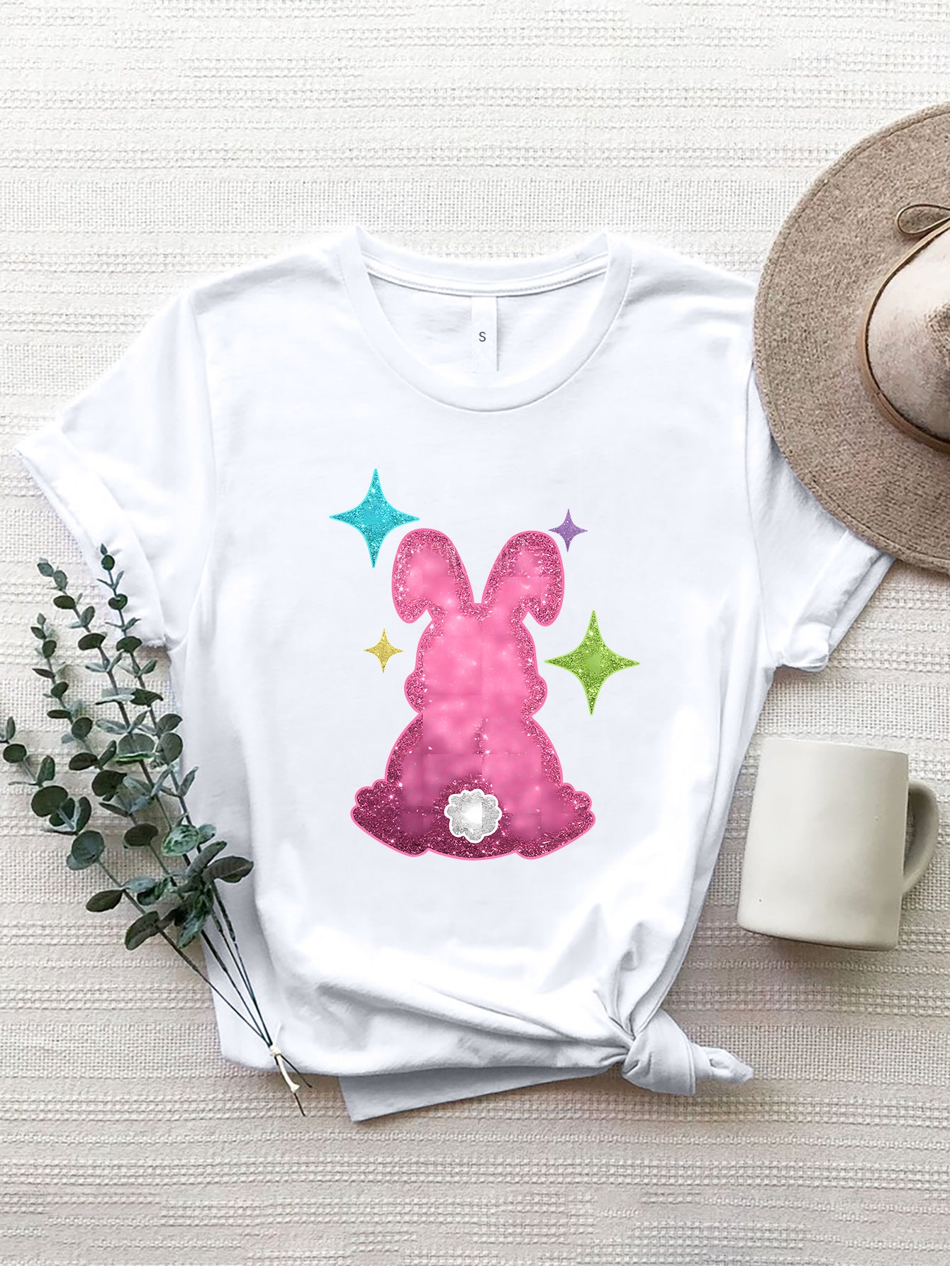 White T-shirt with pink rabbit design and colorful stars