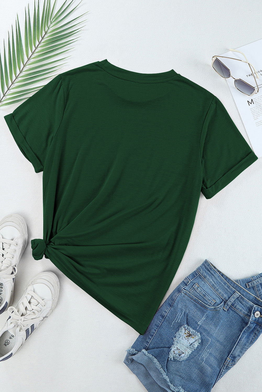 Back view of green MAMA T-shirt with jeans and sunglasses