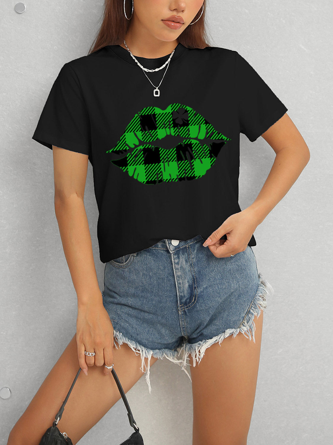 Black t-shirt with green plaid lip design