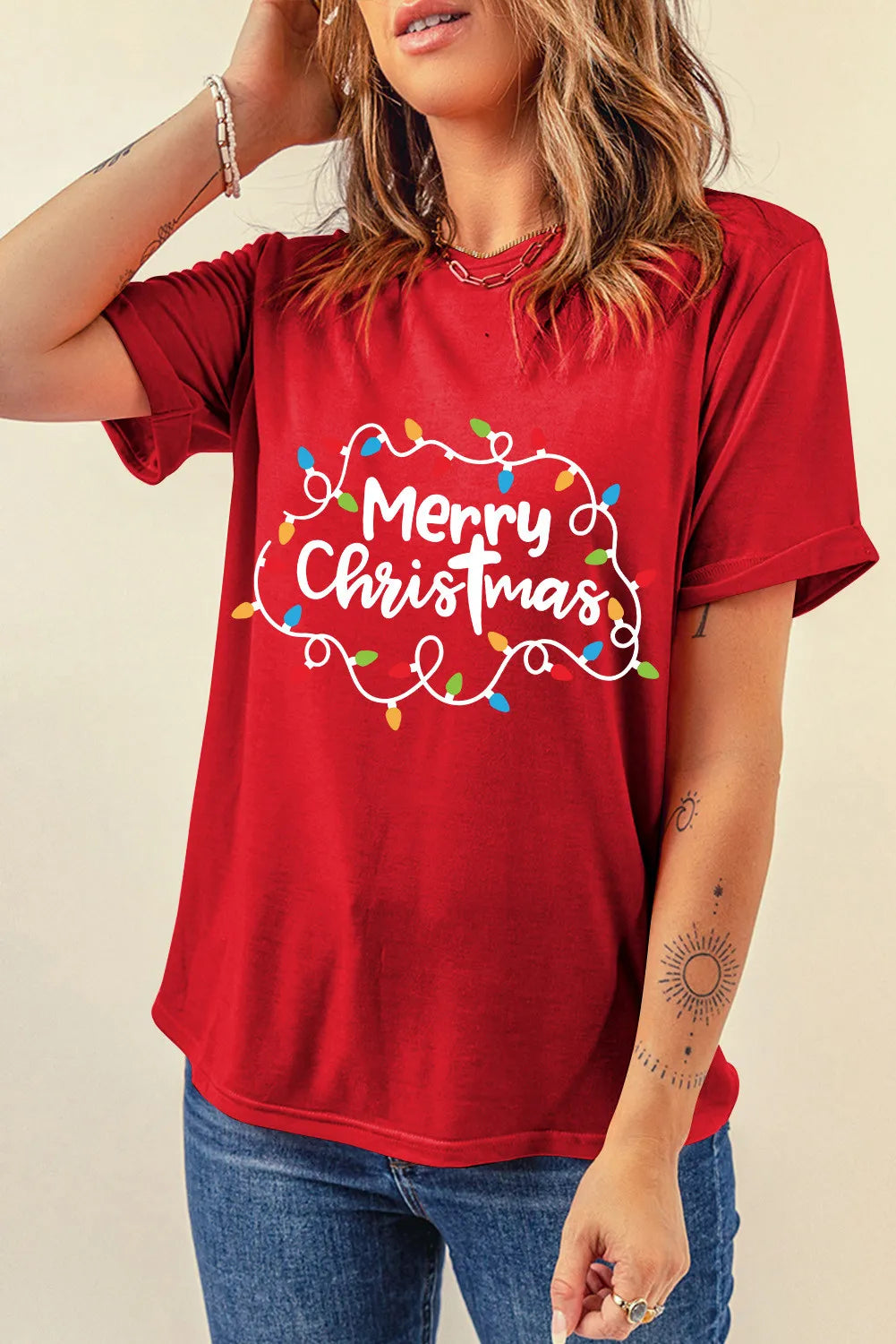 Red Merry Christmas T-shirt featuring colorful lights.