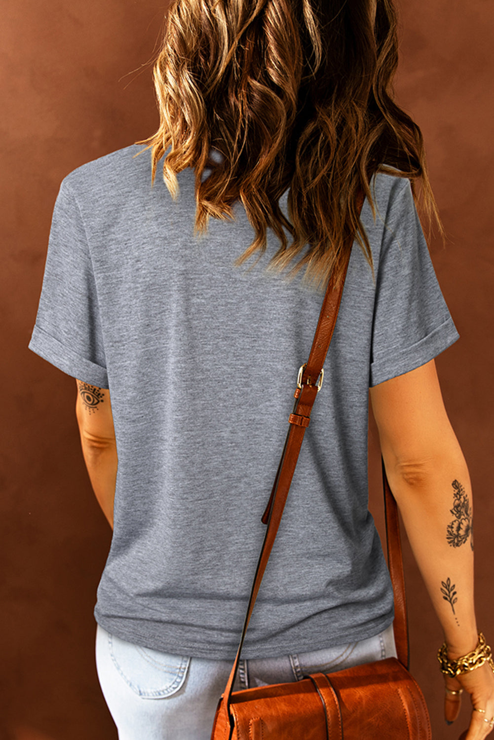 Gray T-shirt with colorful bow graphic design, back view