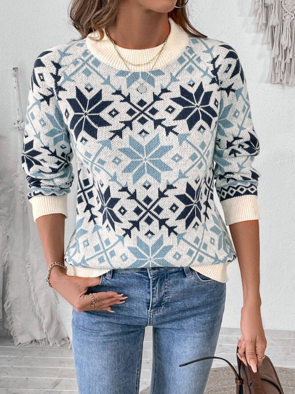 Perfee graphic round neck long sleeve sweater styled with jeans