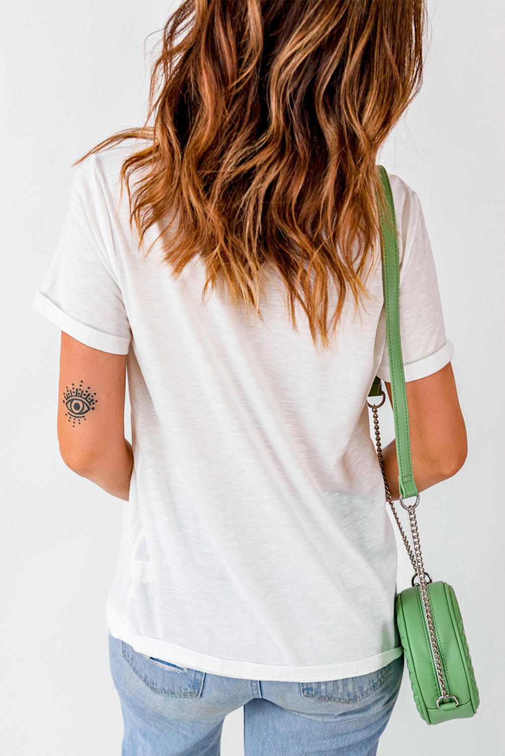 Back view of white T-shirt with rolled sleeves