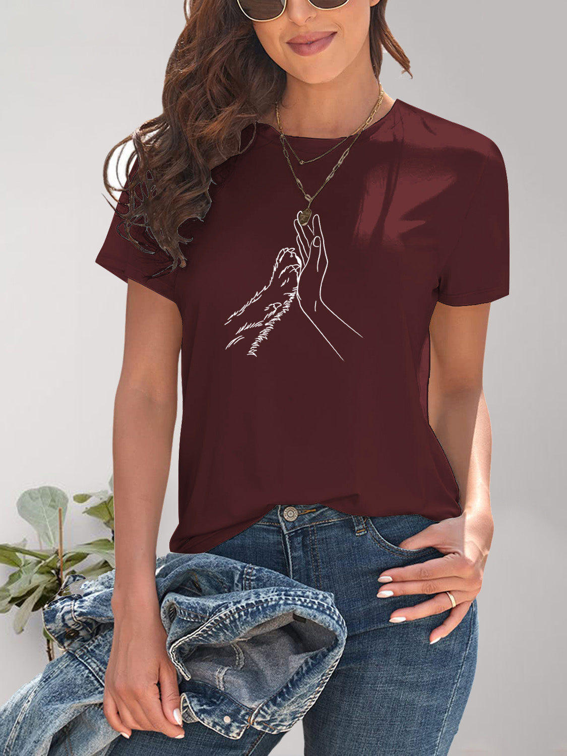 Maroon T-shirt with hand and paw design