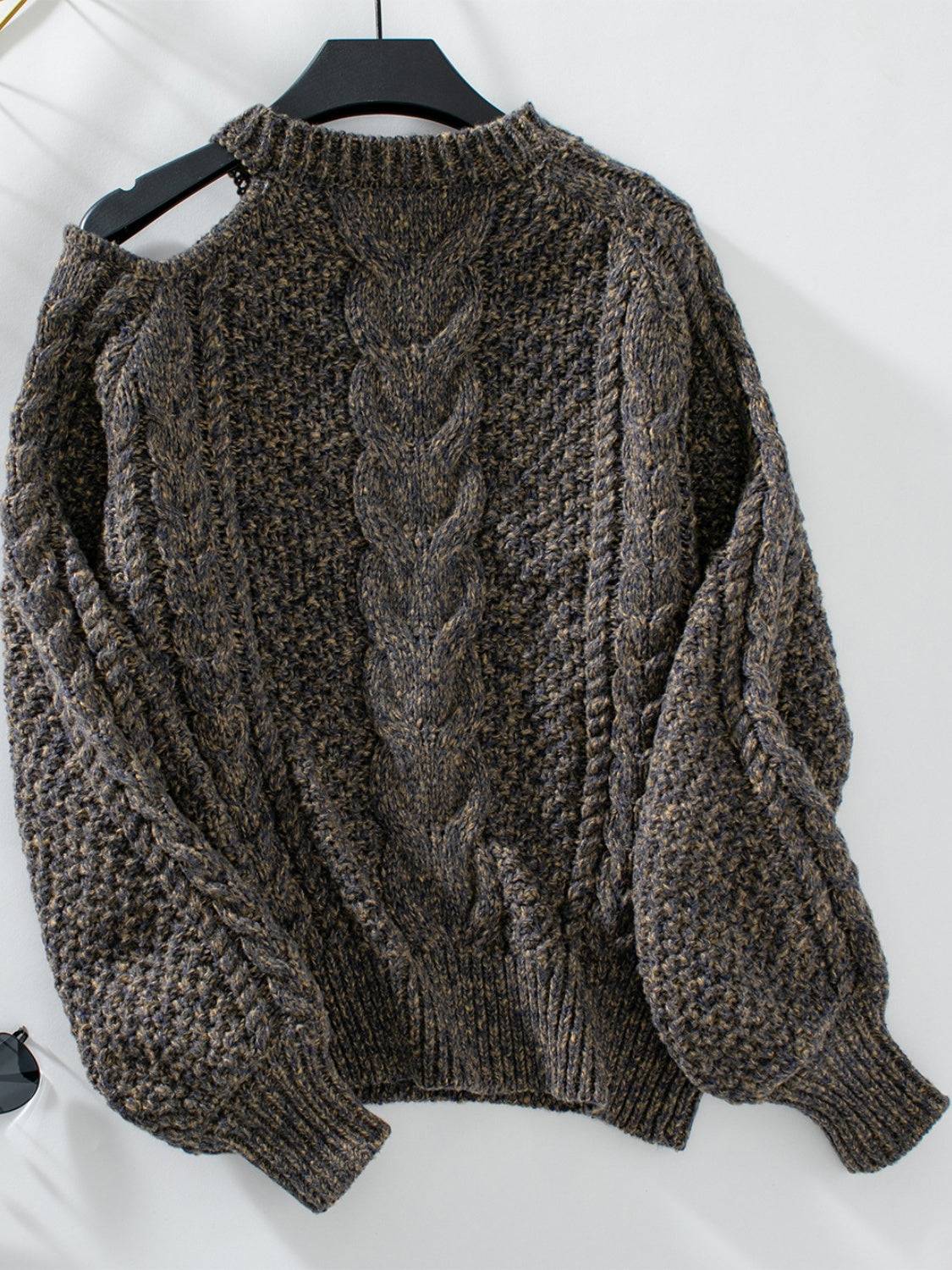Dark cable knit cold shoulder sweater, back view