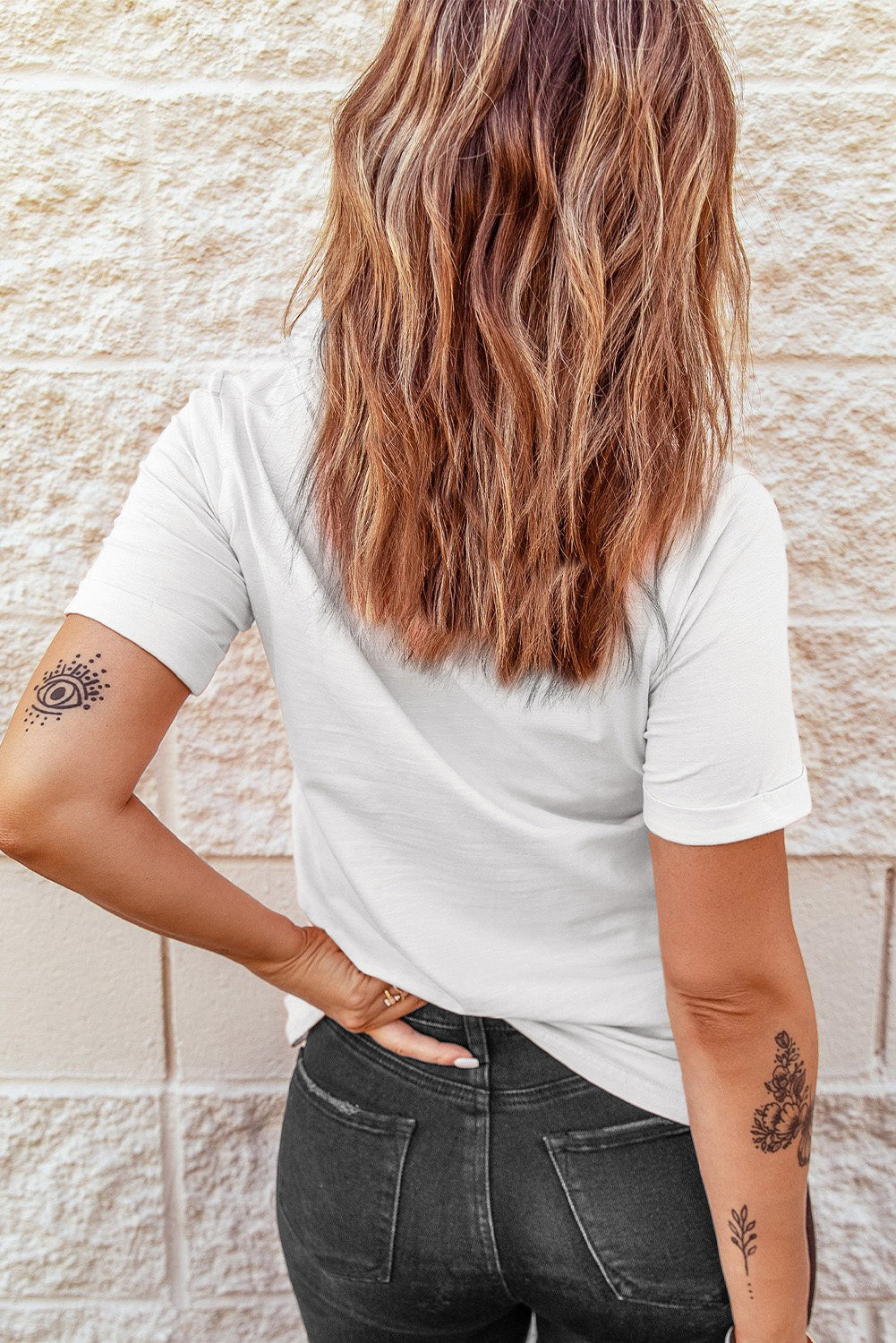 Back view of plain white T-shirt with casual fit.