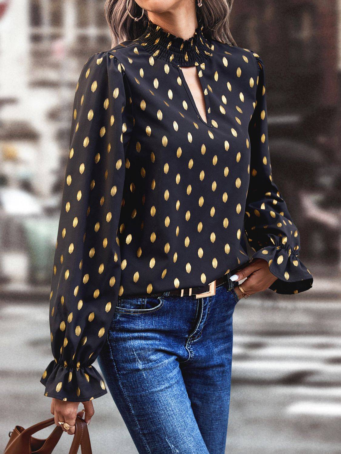 Side view of cutout printed mock neck blouse with flounce sleeves