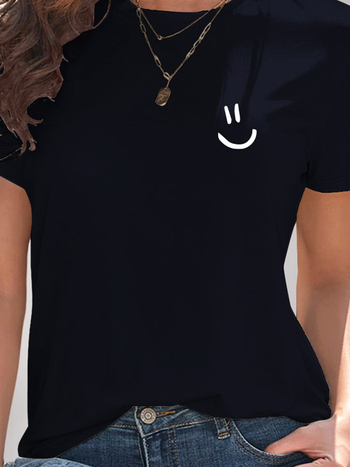 Close-up of navy smile graphic t-shirt