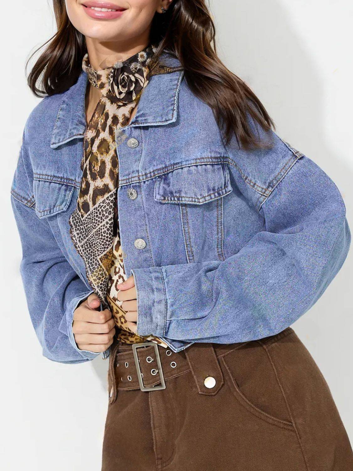 Front view of collared denim top with dropped shoulders.