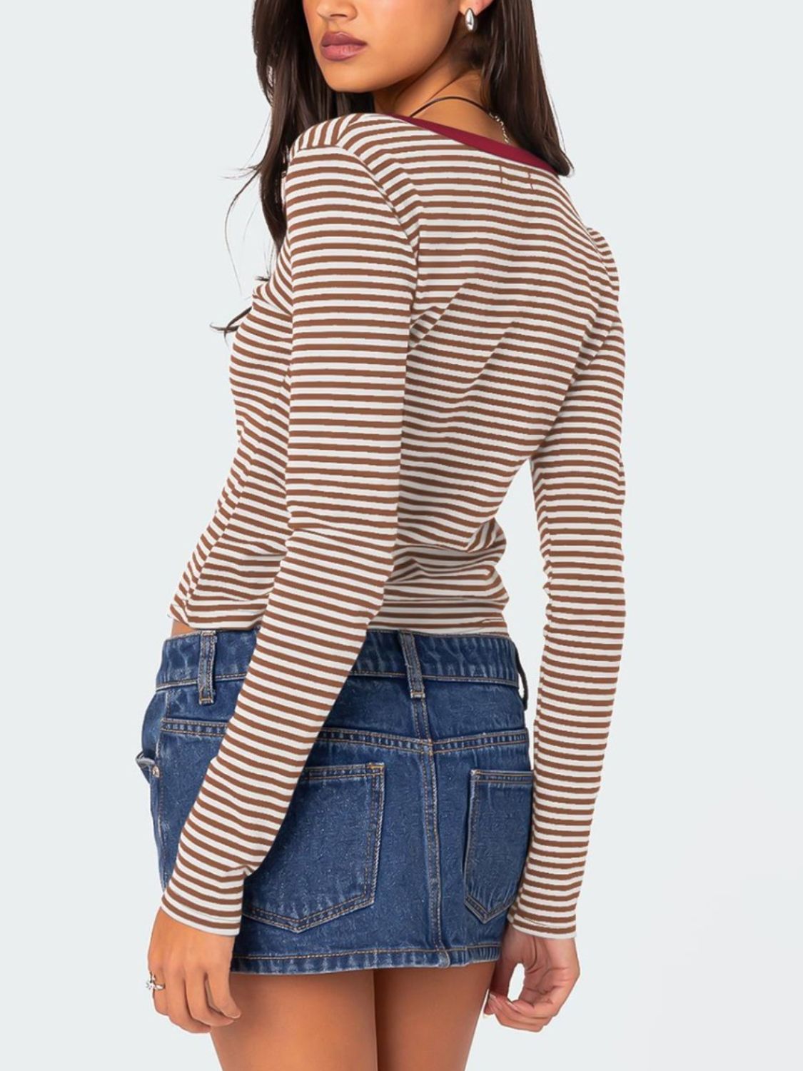 Back view of brown and white striped T-shirt with maroon trim