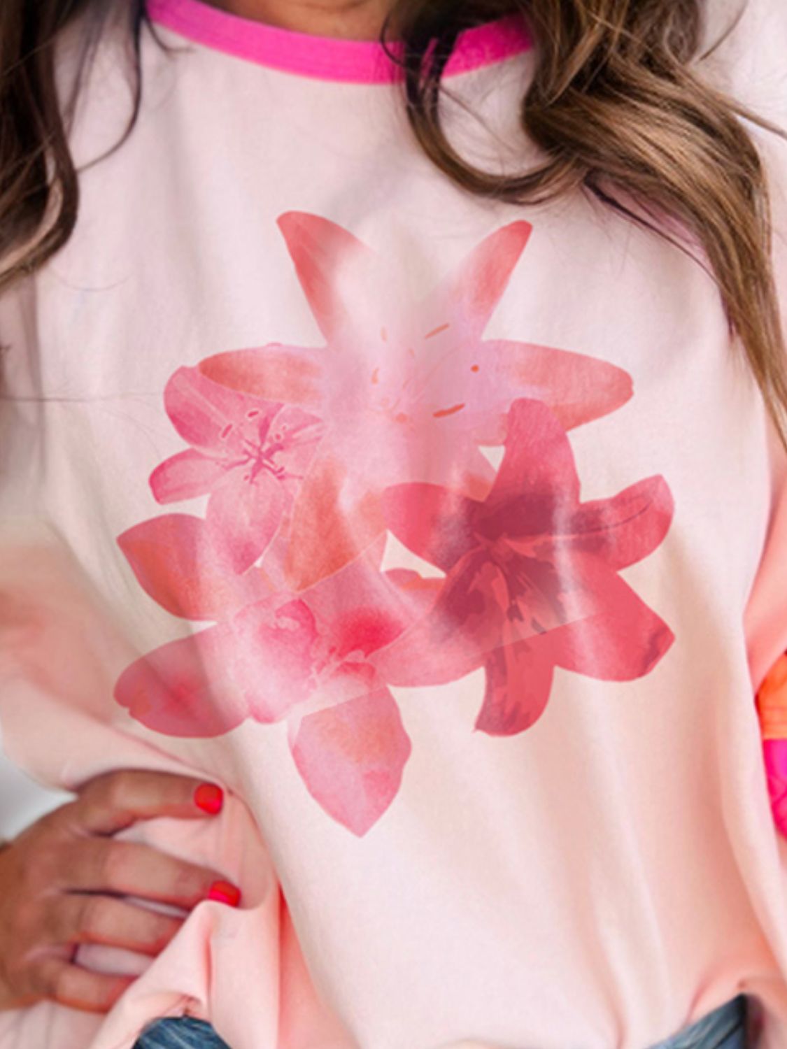 Close-up of floral graphic on round neck T-shirt