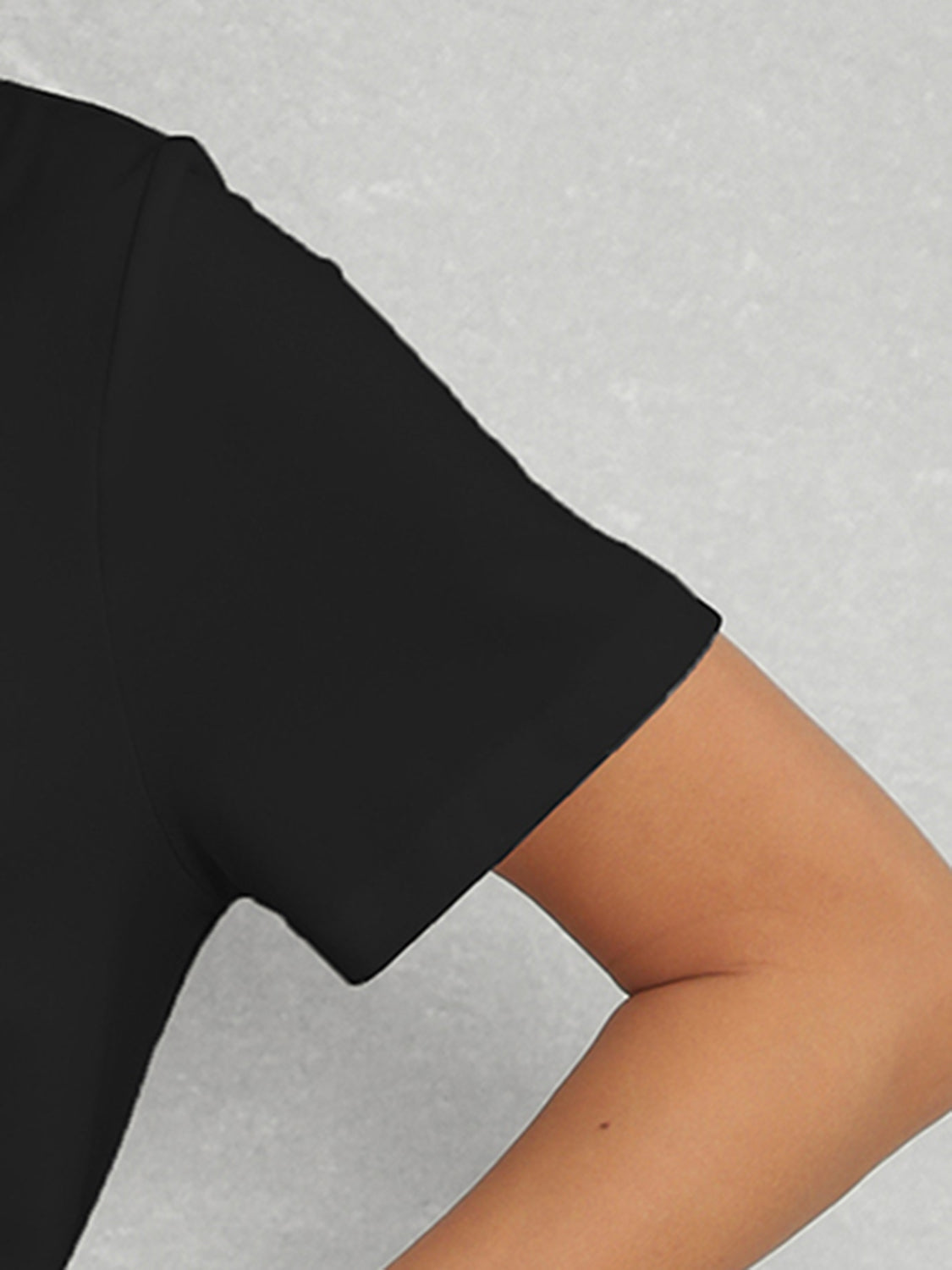 Close-up of short sleeve on black t-shirt