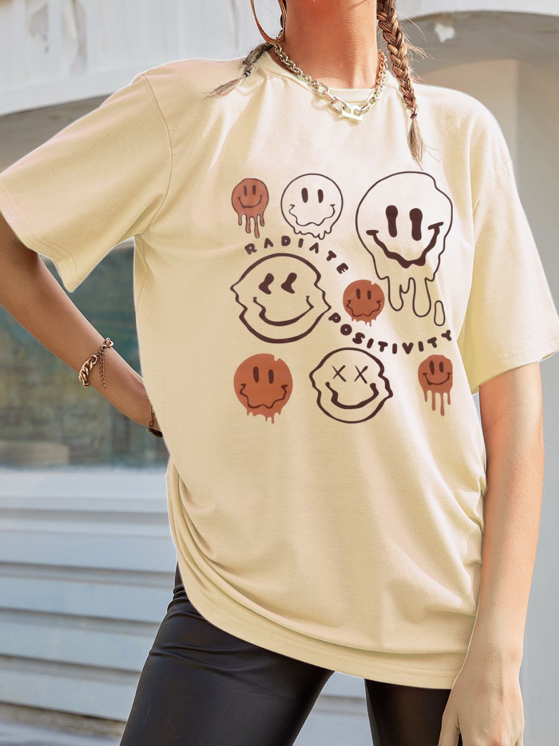 Front view of graphic t-shirt with smiley face design