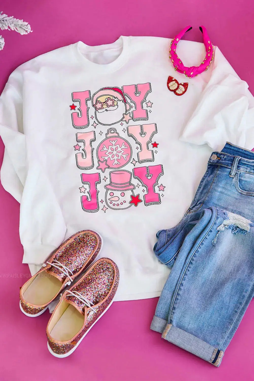 JOY sweatshirt styled with jeans and pink accessories