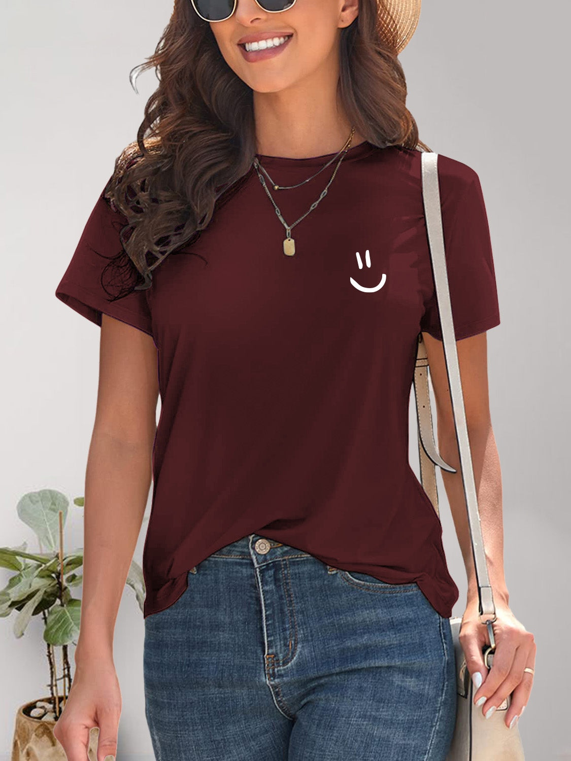 Maroon smile graphic t-shirt with accessories