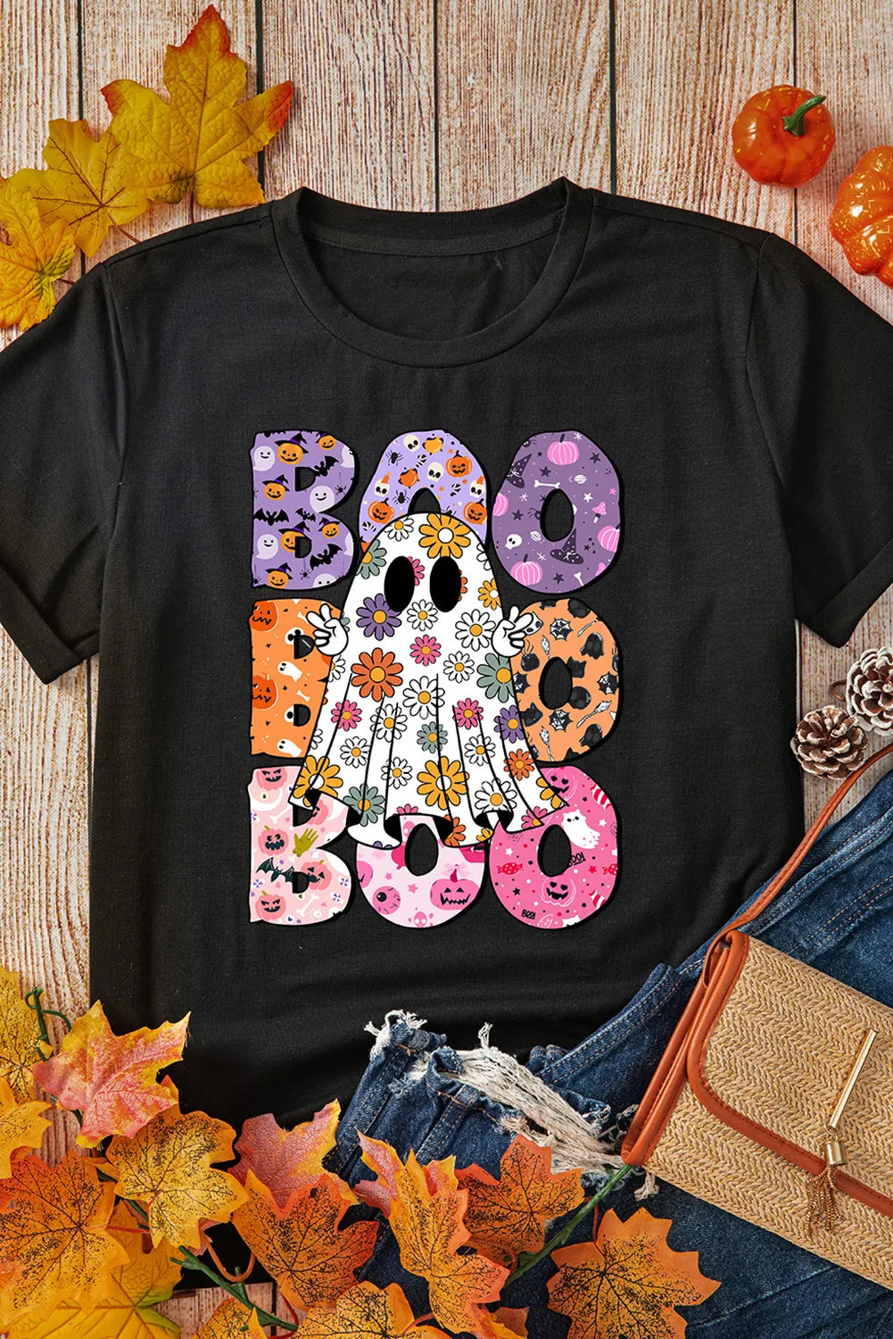 Flat lay of BOO Ghost Graphic T-Shirt with autumn decor