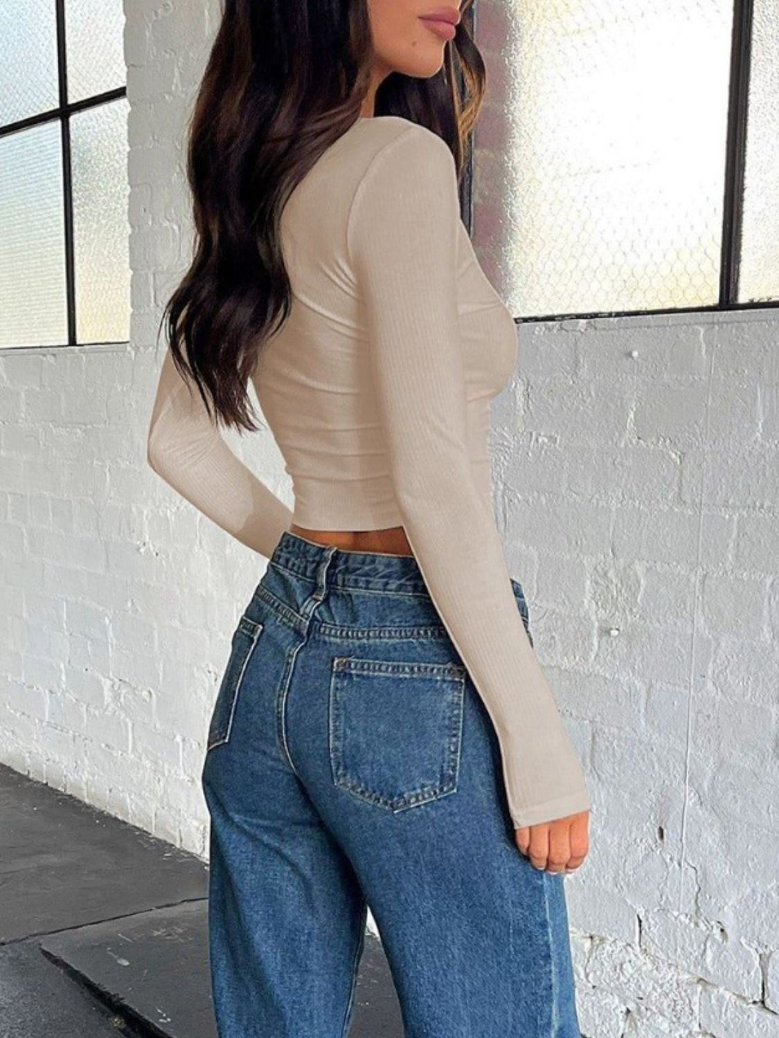 Beige buttoned V-neck long sleeve T-shirt, back view