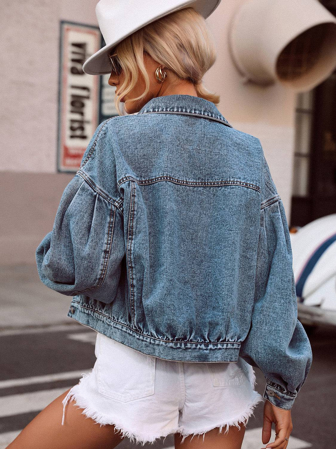 Back view of collared denim top with dropped shoulders