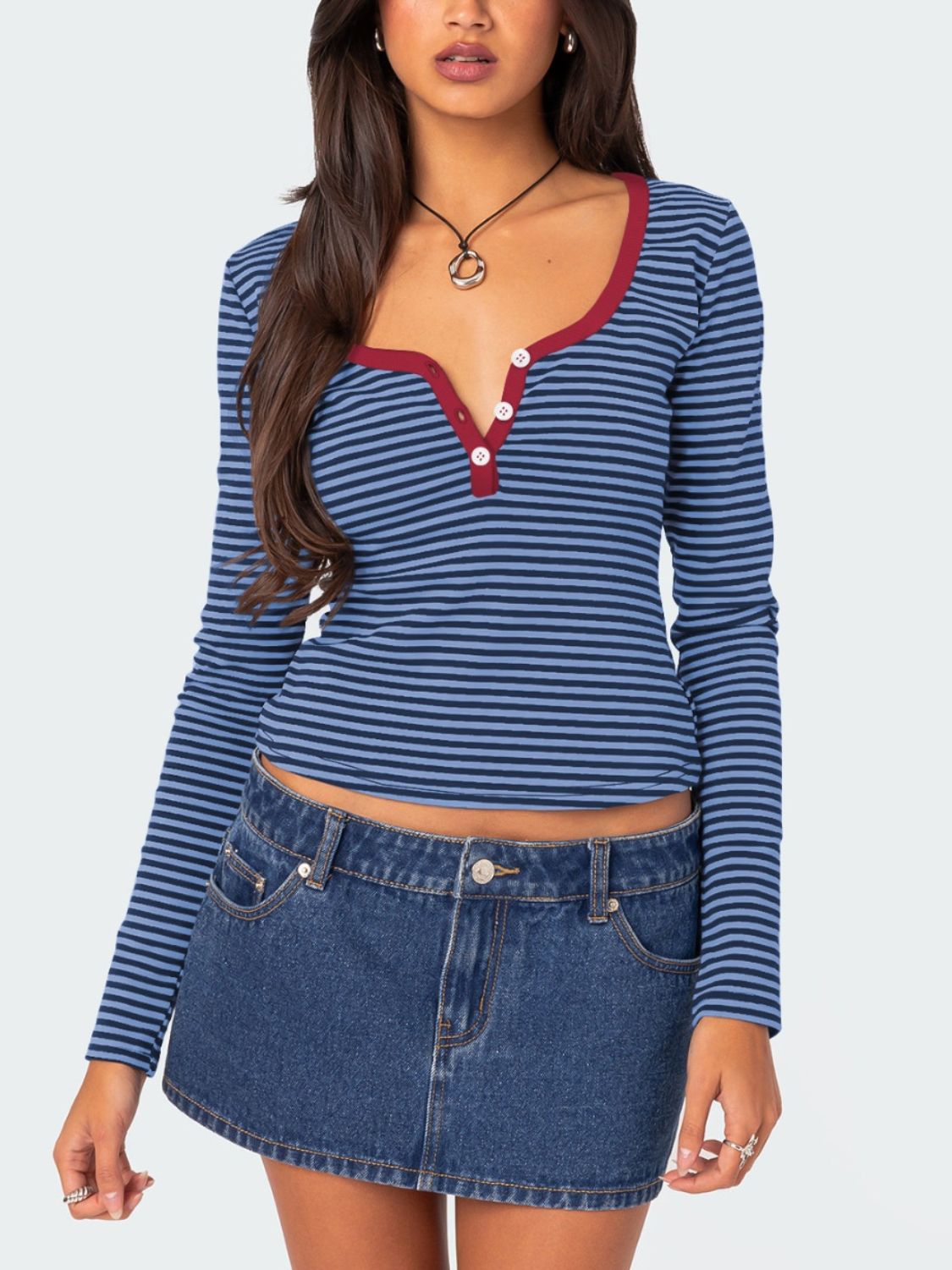 Navy striped T-shirt with maroon trim paired with denim skirt