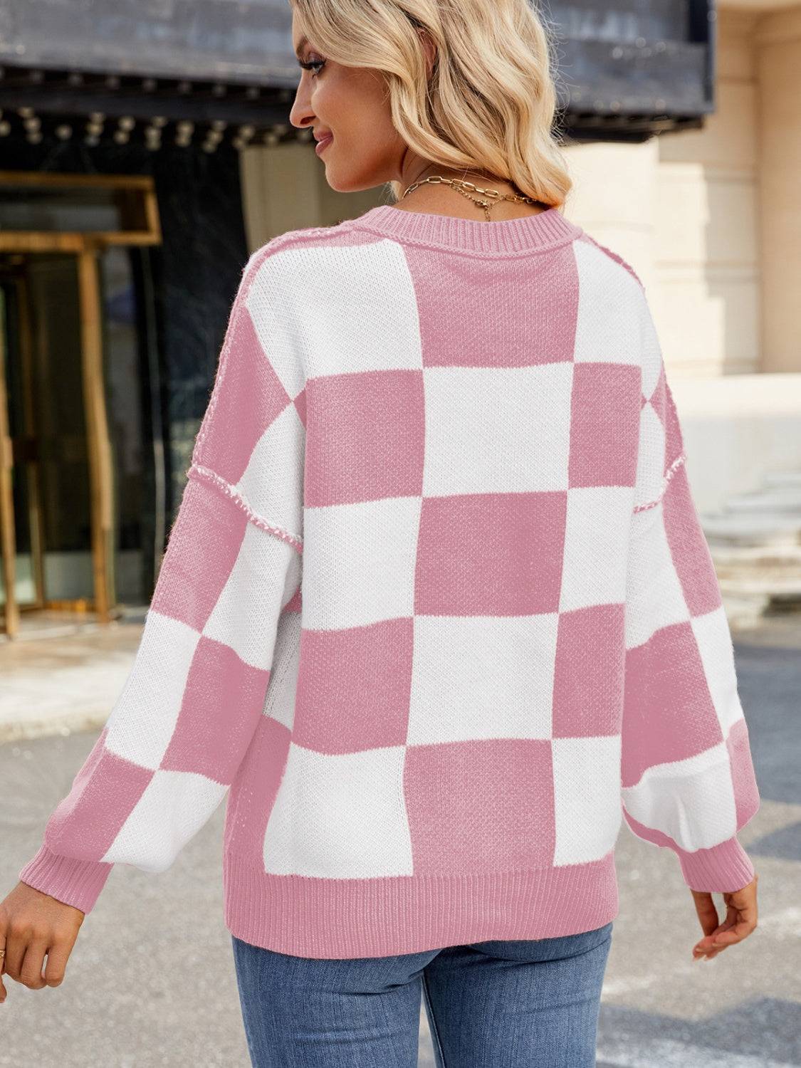 Back view of pink and white checkered sweater