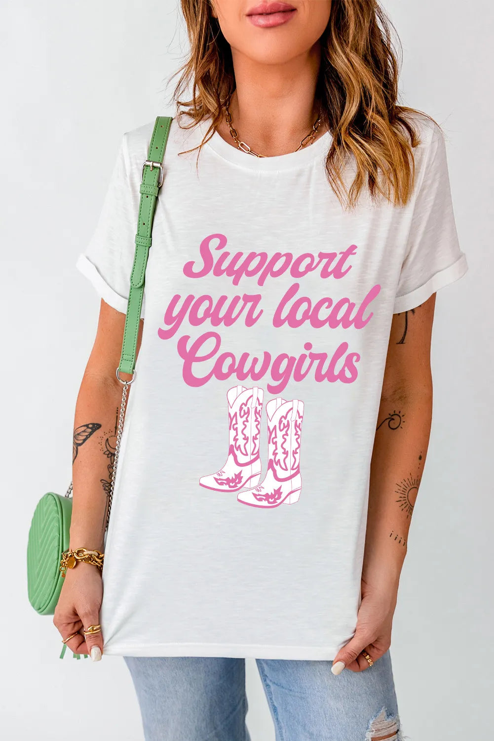 Front view of T-shirt with cowgirl boots graphic