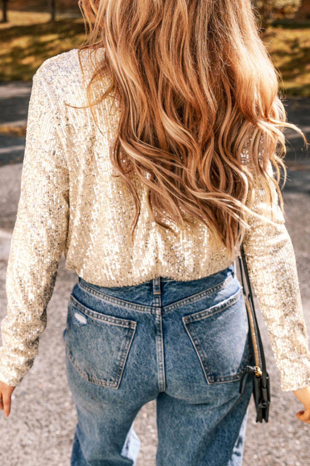 Back view of sequin bodysuit with flowing hair